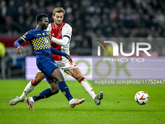 Maccabi Tel Aviv forward Henry Addo and AFC Ajax Amsterdam defender Daniele Rugani play during the match between Ajax and Maccabi Tel Aviv a...