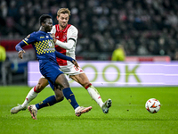 Maccabi Tel Aviv forward Henry Addo and AFC Ajax Amsterdam defender Daniele Rugani play during the match between Ajax and Maccabi Tel Aviv a...