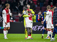 AFC Ajax Amsterdam forward Brian Brobbey and AFC Ajax Amsterdam goalkeeper Remko Pasveer participate in the match between Ajax and Maccabi T...