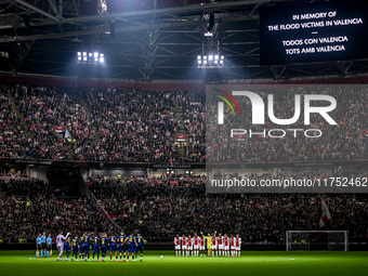 A one-minute silence takes place for the victims of the floods in Valencia during the match between Ajax and Maccabi Tel Aviv at the Johan C...