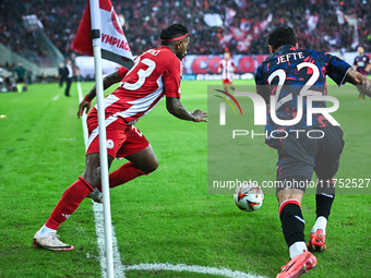 Rodinei of Olympiacos FC competes with Jefte of Rangers during the Europa League, Matchday 4 match between Olympiacos FC and Rangers at Geor...