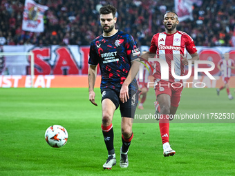 Robin Propper of Rangers competes with Ayoub El Kaabi of Olympiacos FC during the Europa League, Matchday 4 match between Olympiacos FC and...