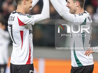 Bartosz Kapustka , Mark Gual , goal celebration during UEFA Conference League match Legia Warsaw vs Dinamo Minsk in Warsaw Poland on 7 Novem...