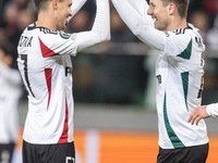 Bartosz Kapustka , Mark Gual , goal celebration during UEFA Conference League match Legia Warsaw vs Dinamo Minsk in Warsaw Poland on 7 Novem...