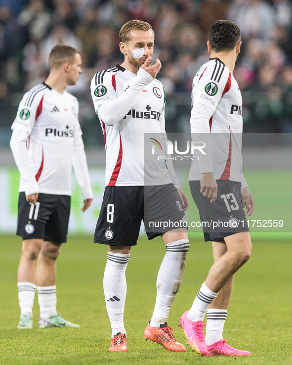 Kacper Chodyna , Rafal Augustyniak , Pawel Wszolek  during UEFA Conference League match Legia Warsaw vs Dinamo Minsk in Warsaw Poland on 7 N...