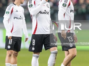 Kacper Chodyna , Rafal Augustyniak , Pawel Wszolek  during UEFA Conference League match Legia Warsaw vs Dinamo Minsk in Warsaw Poland on 7 N...