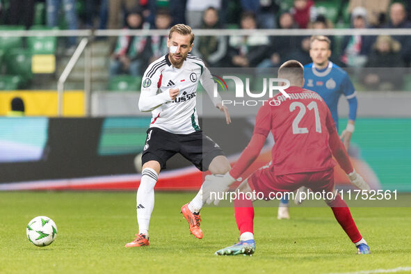 Rafal Augustyniak , Fedor Lapoukhov  during UEFA Conference League match Legia Warsaw vs Dinamo Minsk in Warsaw Poland on 7 November 2024. 