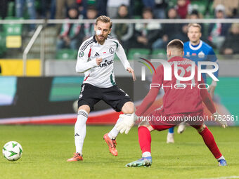 Rafal Augustyniak , Fedor Lapoukhov  during UEFA Conference League match Legia Warsaw vs Dinamo Minsk in Warsaw Poland on 7 November 2024. (