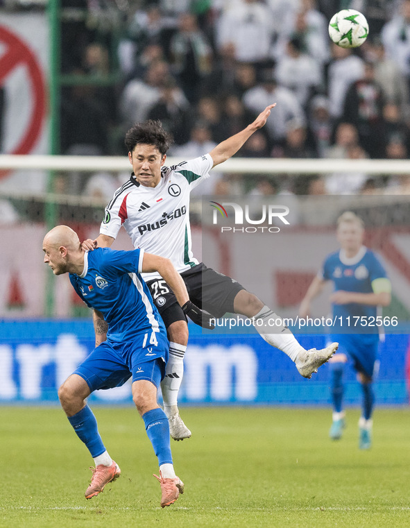 Pavel Sedko , Ryoya Morishita  during UEFA Conference League match Legia Warsaw vs Dinamo Minsk in Warsaw Poland on 7 November 2024. 