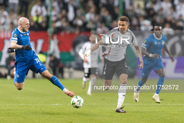 Pavel Sedko , Steve Kapuadi  during UEFA Conference League match Legia Warsaw vs Dinamo Minsk in Warsaw Poland on 7 November 2024. 