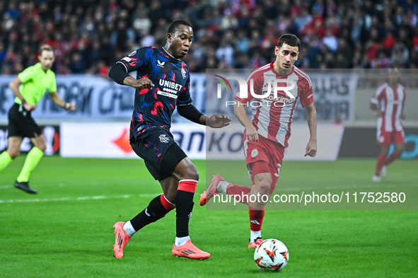 Neraysho Kasanwirjo of Rangers competes with Santiago Hezze of Olympiacos FC during the Europa League, Matchday 4 match between Olympiacos F...