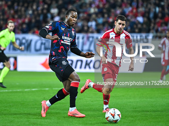 Neraysho Kasanwirjo of Rangers competes with Santiago Hezze of Olympiacos FC during the Europa League, Matchday 4 match between Olympiacos F...