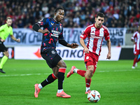 Neraysho Kasanwirjo of Rangers competes with Santiago Hezze of Olympiacos FC during the Europa League, Matchday 4 match between Olympiacos F...