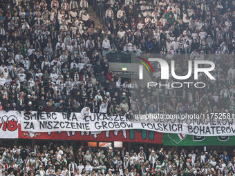 Legia fans present a banner insulting Aleksandr Lukashenko during UEFA Conference League match Legia Warsaw vs Dinamo Minsk in Warsaw Poland...