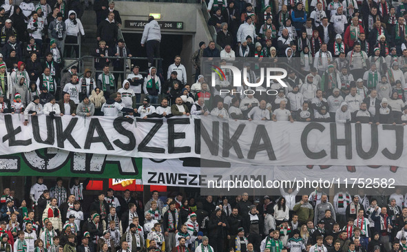 Legia fans present a banner insulting Aleksandr Lukashenko during UEFA Conference League match Legia Warsaw vs Dinamo Minsk in Warsaw Poland...