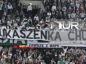 Legia fans present a banner insulting Aleksandr Lukashenko during UEFA Conference League match Legia Warsaw vs Dinamo Minsk in Warsaw Poland...