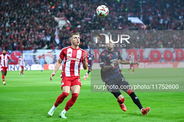 Costinha of Olympiacos FC competes with Jefte of Rangers during the Europa League, Matchday 4 match between Olympiacos FC and Rangers at Geo...