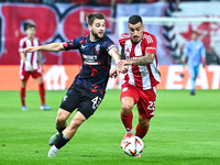 Nicolas Raskin of Rangers competes with Chiquinho of Olympiacos FC during the Europa League, Matchday 4 match between Olympiacos FC and Rang...