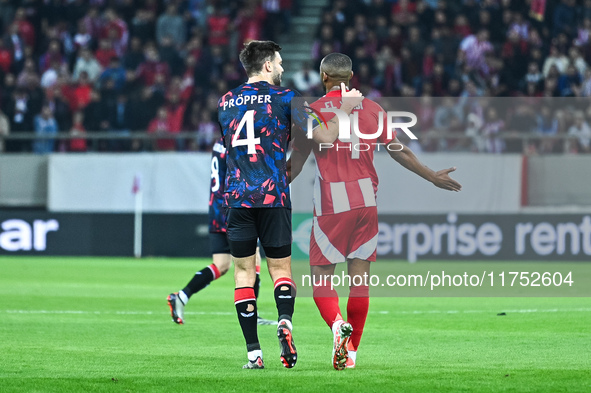 Ayoub El Kaabi of Olympiacos FC competes with a player from Rangers during the Europa League, Matchday 4 match between Olympiacos FC and Ran...