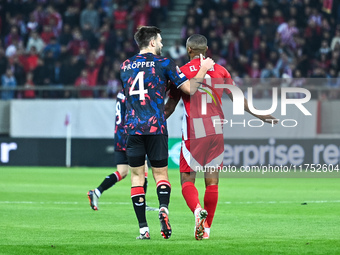 Ayoub El Kaabi of Olympiacos FC competes with a player from Rangers during the Europa League, Matchday 4 match between Olympiacos FC and Ran...