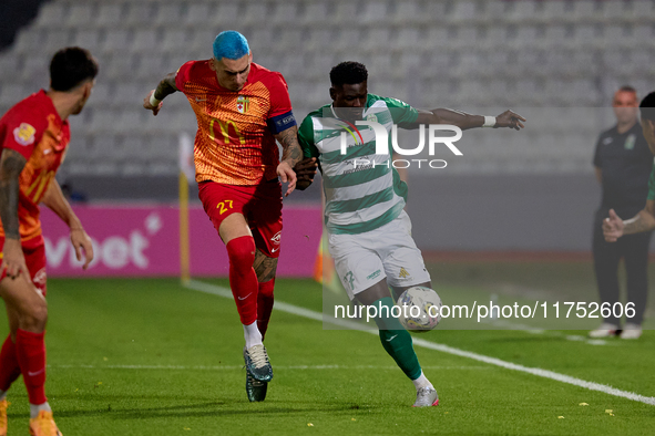 In Ta' Qali, Malta, on November 7, 2024, Franklin Sasere of Floriana is closely challenged by Alessandro Coppola of Birkirkara during the Ma...