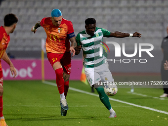 In Ta' Qali, Malta, on November 7, 2024, Franklin Sasere of Floriana is closely challenged by Alessandro Coppola of Birkirkara during the Ma...