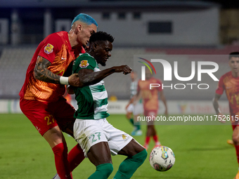 In Ta' Qali, Malta, on November 7, 2024, Franklin Sasere of Floriana is closely marked by Alessandro Coppola of Birkirkara during the Malta...