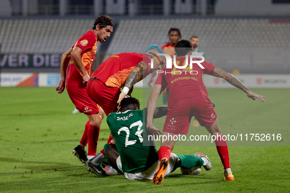 In Ta' Qali, Malta, on November 7, 2024, Franklin Sasere of Floriana tries to protect the ball from Birkirkara players Pablo Gaitan, Alessan...