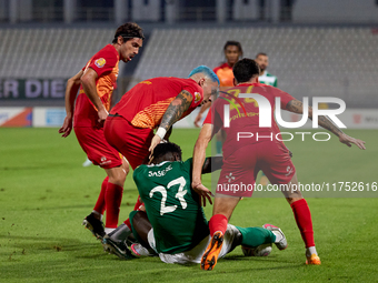 In Ta' Qali, Malta, on November 7, 2024, Franklin Sasere of Floriana tries to protect the ball from Birkirkara players Pablo Gaitan, Alessan...