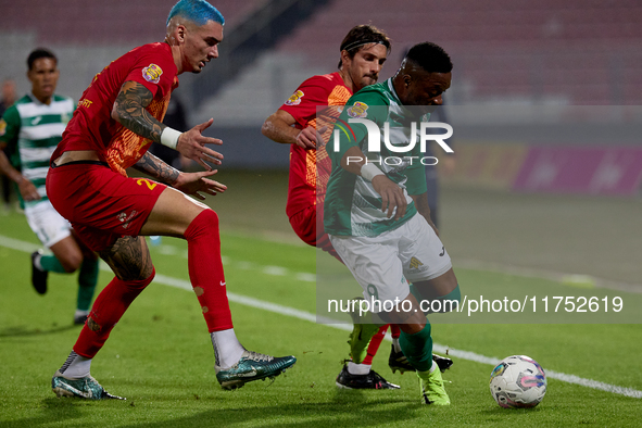 In Ta' Qali, Malta, on November 7, 2024, Kemar Reid of Floriana is closely followed by Alessandro Coppola of Birkirkara during the Malta 360...