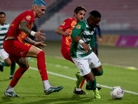 In Ta' Qali, Malta, on November 7, 2024, Kemar Reid of Floriana is closely followed by Alessandro Coppola of Birkirkara during the Malta 360...