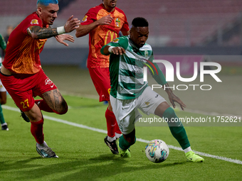 In Ta' Qali, Malta, on November 7, 2024, Kemar Reid of Floriana is closely followed by Alessandro Coppola of Birkirkara during the Malta 360...