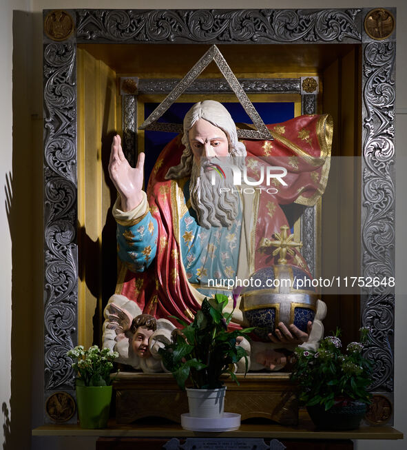 A close-up of a statue representing God the Father is displayed in a church in Foggia, Italy, on April 3, 2024. The vibrant statue features...