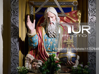 A close-up of a statue representing God the Father is displayed in a church in Foggia, Italy, on April 3, 2024. The vibrant statue features...