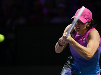 RIYADH, SAUDI ARABIA - NOVEMBER 07: Iga Swiatek of Poland during her match against Daria Kasatkina, on Day 6 of the 2024 WTA Finals, part of...