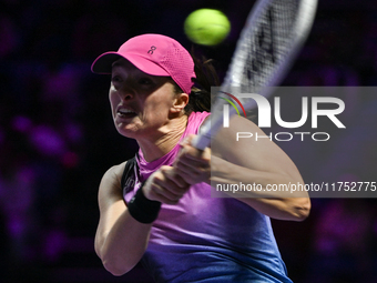 RIYADH, SAUDI ARABIA - NOVEMBER 07: Iga Swiatek of Poland during her match against Daria Kasatkina, on Day 6 of the 2024 WTA Finals, part of...