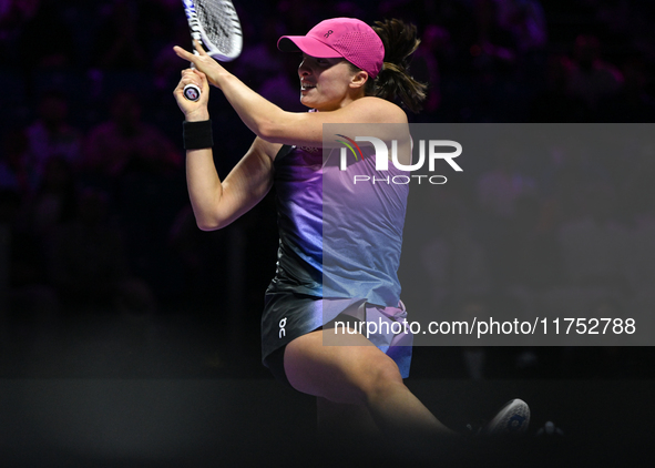 RIYADH, SAUDI ARABIA - NOVEMBER 07: Iga Swiatek of Poland during her match against Daria Kasatkina, on Day 6 of the 2024 WTA Finals, part of...