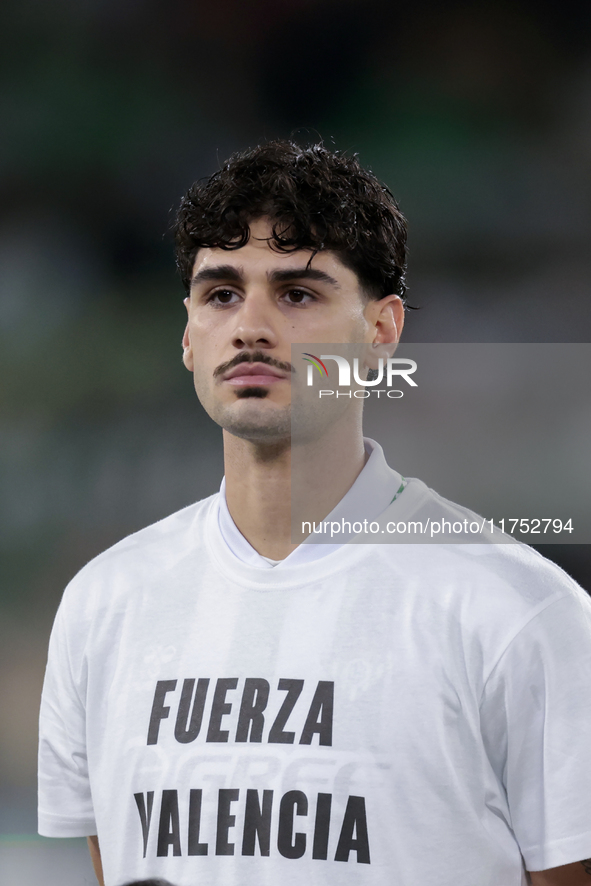 Johnny Cardoso of Real Betis poses with a t-shirt supporting the province of Valencia during the UEFA Conference League 2024/25 League Phase...