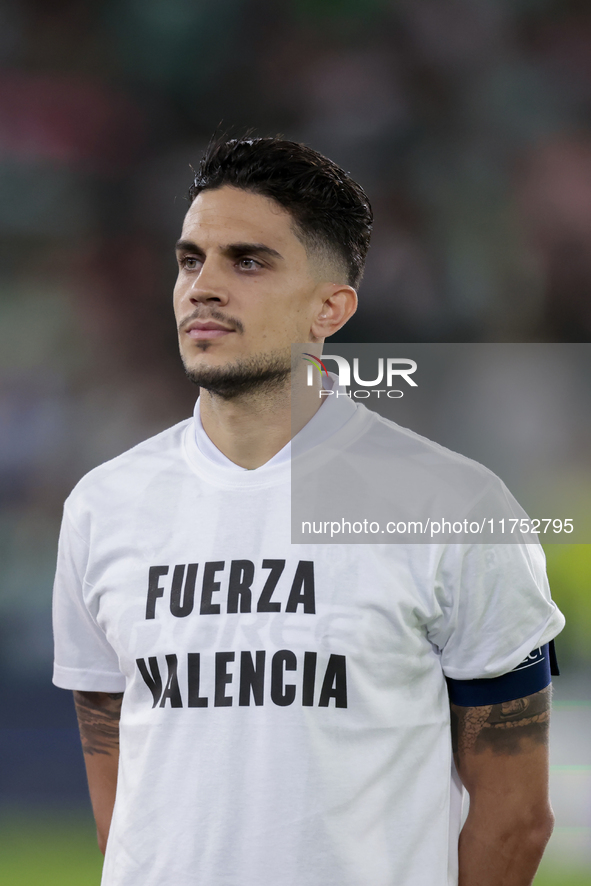 Marc Bartra of Real Betis poses with a t-shirt supporting the province of Valencia during the UEFA Conference League 2024/25 League Phase MD...