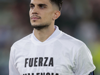 Marc Bartra of Real Betis poses with a t-shirt supporting the province of Valencia during the UEFA Conference League 2024/25 League Phase MD...