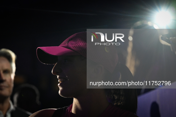 RIYADH, SAUDI ARABIA - NOVEMBER 07: Iga Swiatek of Poland interacts with fans after her victory over Daria Kasatkina on Day 6 of the 2024 WT...