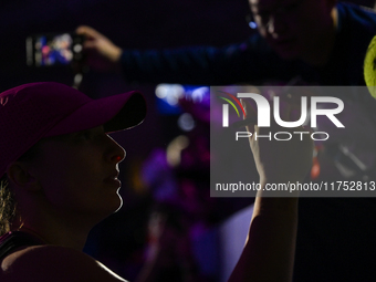 RIYADH, SAUDI ARABIA - NOVEMBER 07: Iga Swiatek of Poland interacts with fans after her victory over Daria Kasatkina on Day 6 of the 2024 WT...