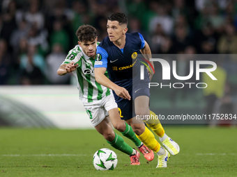 Juanjo Nieto of NK Celje competes for the ball with Ez Abde of Real Betis during the UEFA Conference League 2024/25 League Phase MD3 match b...