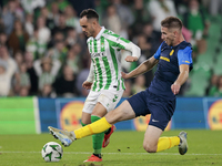 Juanmi of Real Betis hits the ball during the UEFA Conference League 2024/25 League Phase MD3 match between Real Betis and NK Celje at Benit...