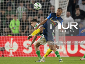 In Seville, Spain, on November 7, 2024, Edmilson of NK Celje competes for the ball with Marc Bartra of Real Betis during the UEFA Conference...