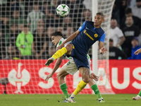 In Seville, Spain, on November 7, 2024, Edmilson of NK Celje competes for the ball with Marc Bartra of Real Betis during the UEFA Conference...