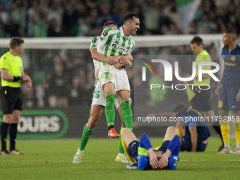 Sergi Altimira of Real Betis and Juanmi of Real Betis celebrate winning during the UEFA Conference League 2024/25 League Phase MD3 match bet...