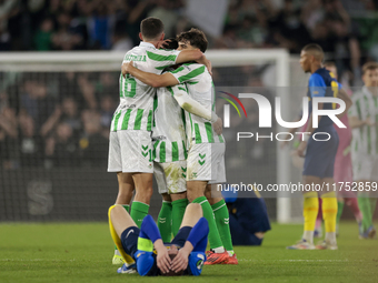 In Seville, Spain, on November 7, 2024, Sergi Altimira, Juanmi, and Johnny Cardoso of Real Betis play during the UEFA Conference League 2024...