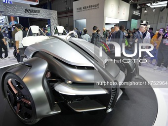 Visitors look at the Yamaha TRICERA electric three-wheel concept car at the 7th CIIE in Shanghai, China, on November 6, 2024. (