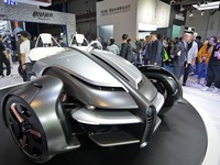 Visitors look at the Yamaha TRICERA electric three-wheel concept car at the 7th CIIE in Shanghai, China, on November 6, 2024. (